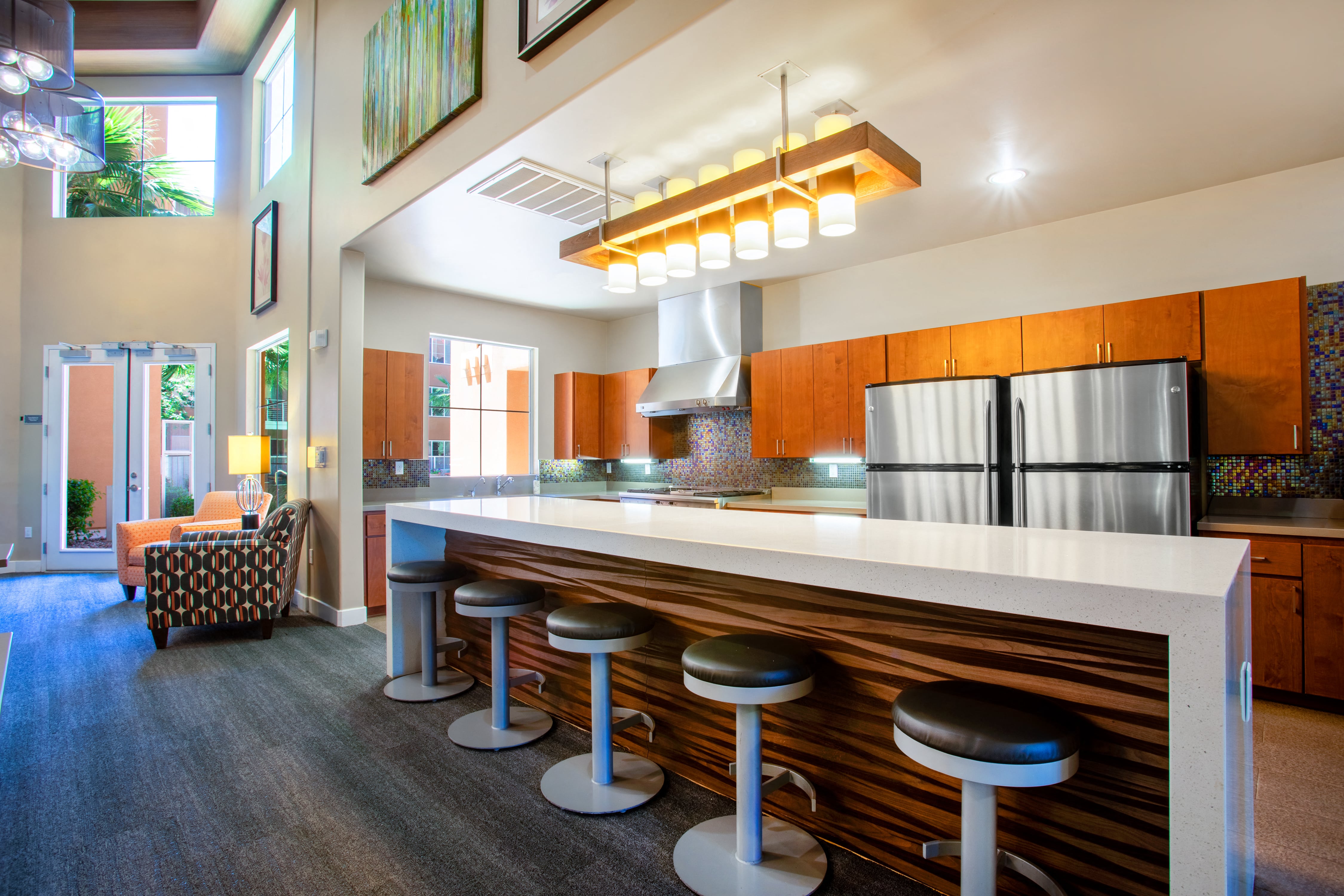 a kitchen with a counter top and stools