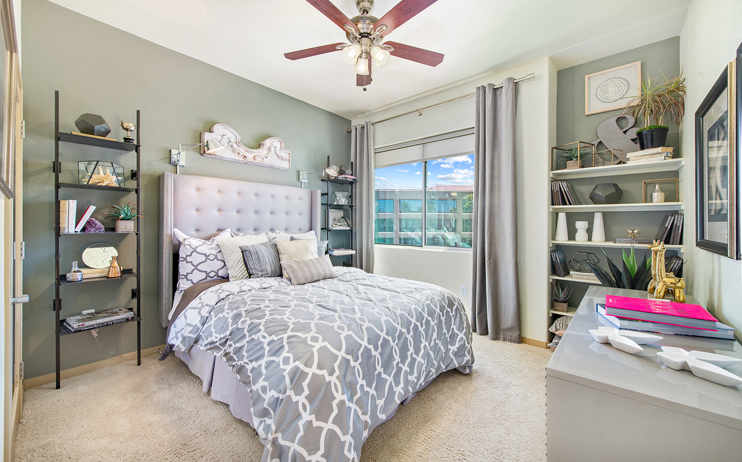 a bedroom with a bed and a ceiling fan