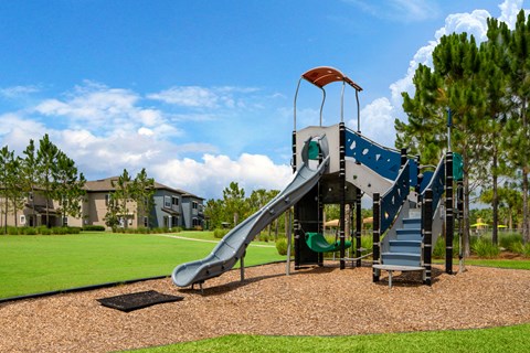 a playground with a slide in a park