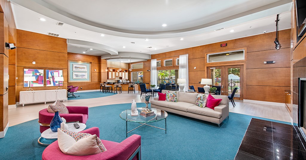 A living room with a couch, chairs, and a coffee table.