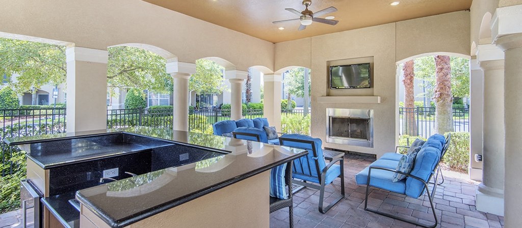 a living room with a bar and a fireplace
