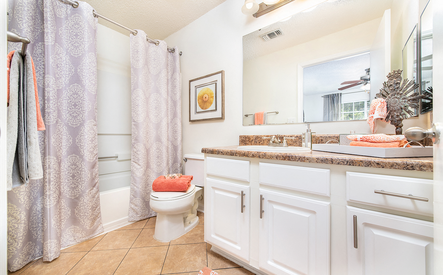 a bathroom with a shower and a sink and a toilet