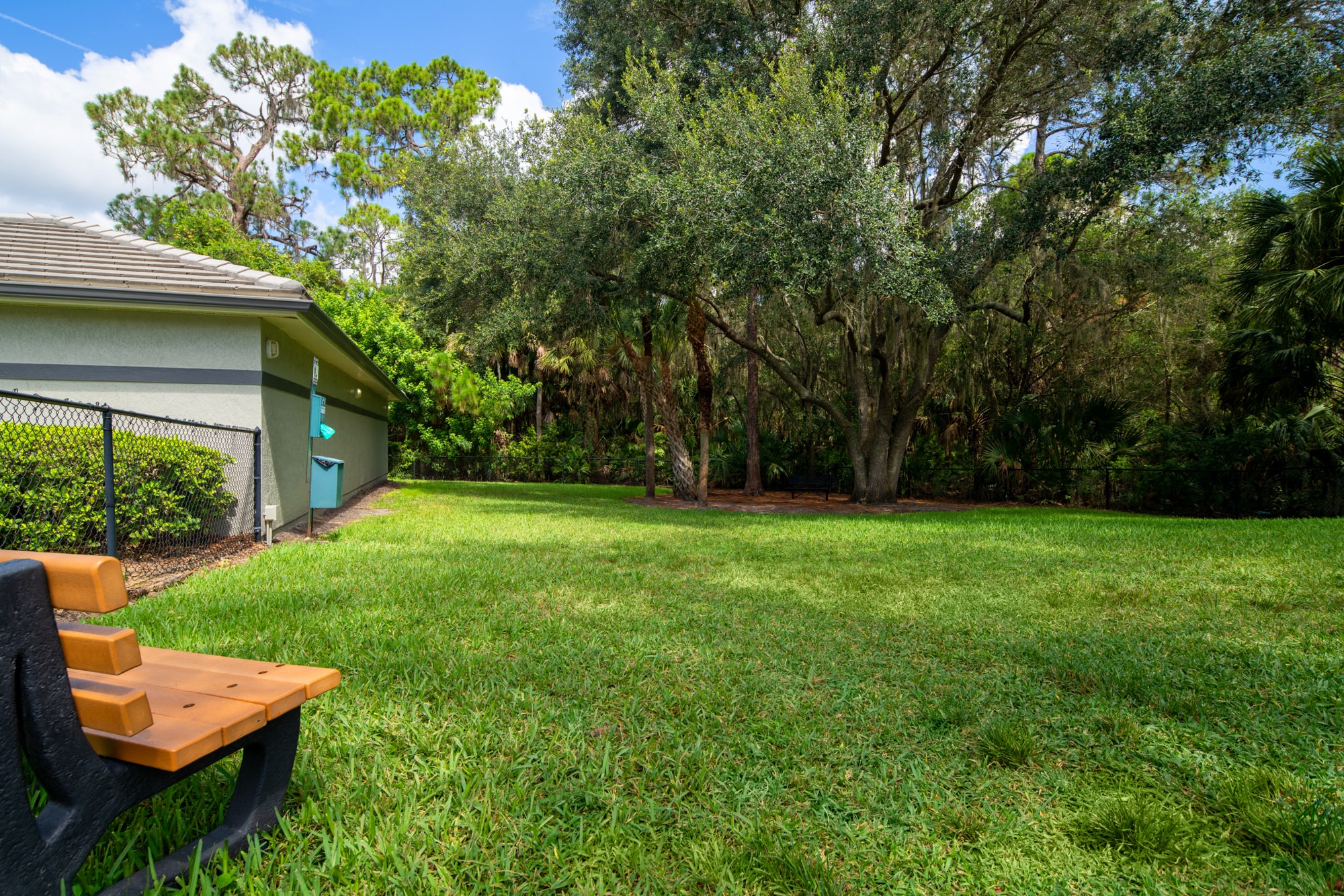 a backyard with a picnic table and a house