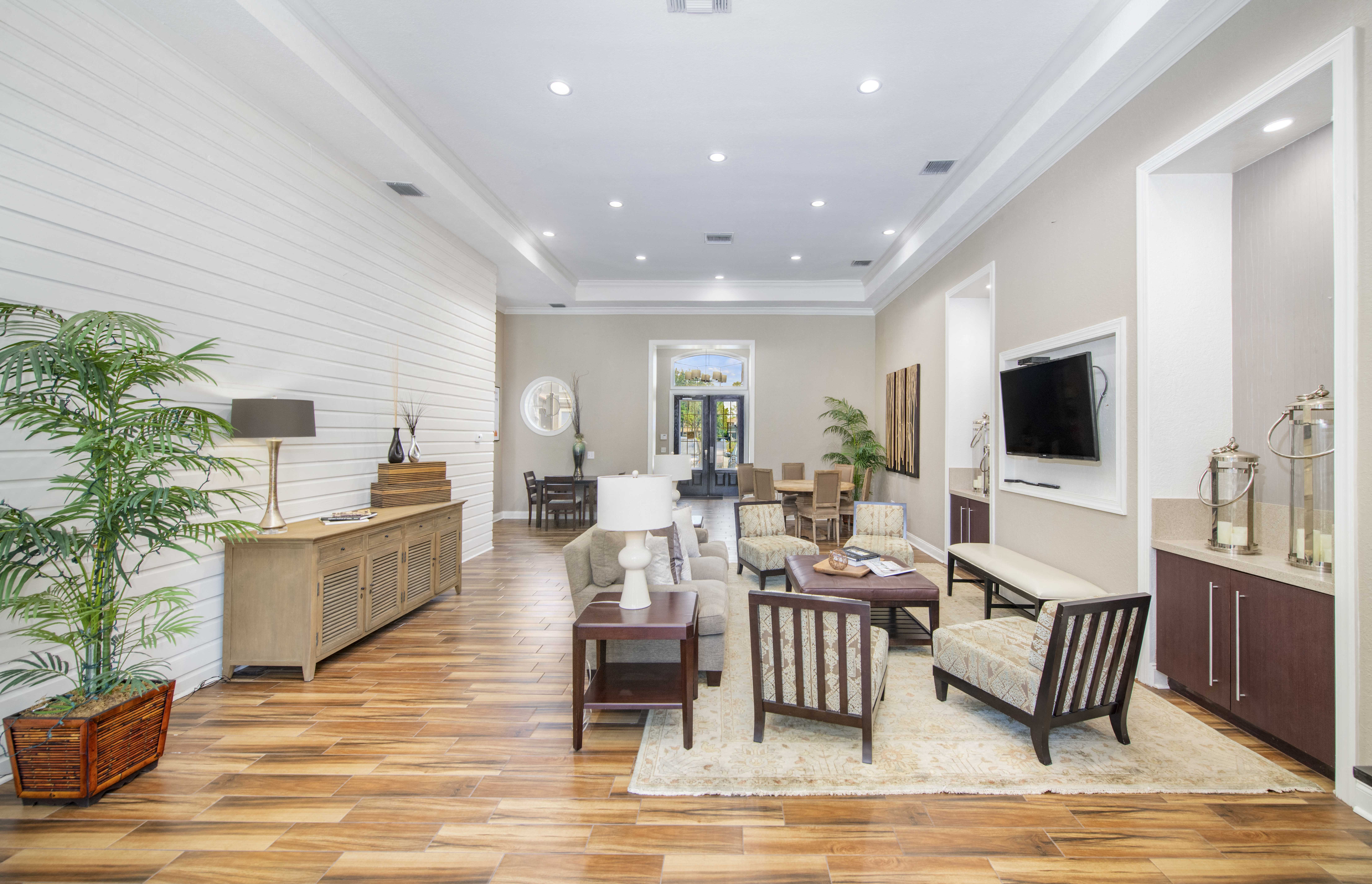 a living room with a couch and a table and a tv