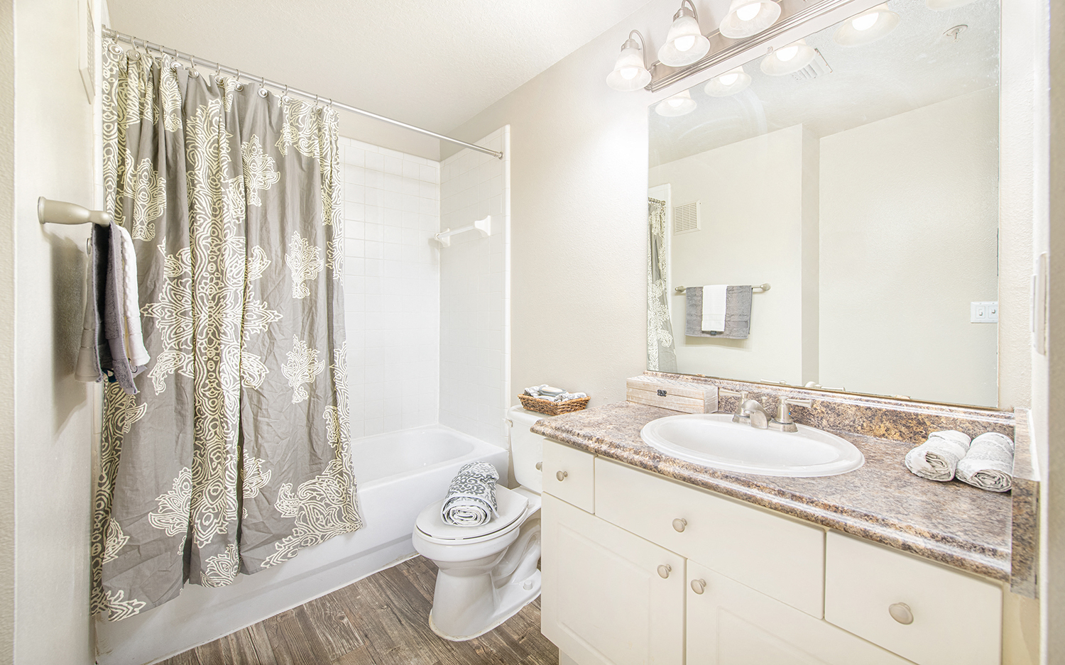 a bathroom with a shower toilet and sink