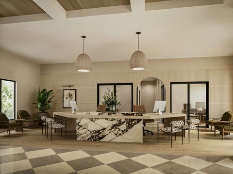 A reception area with a marble counter and chairs.