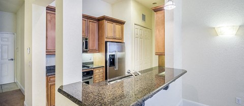 a kitchen with a granite counter top and