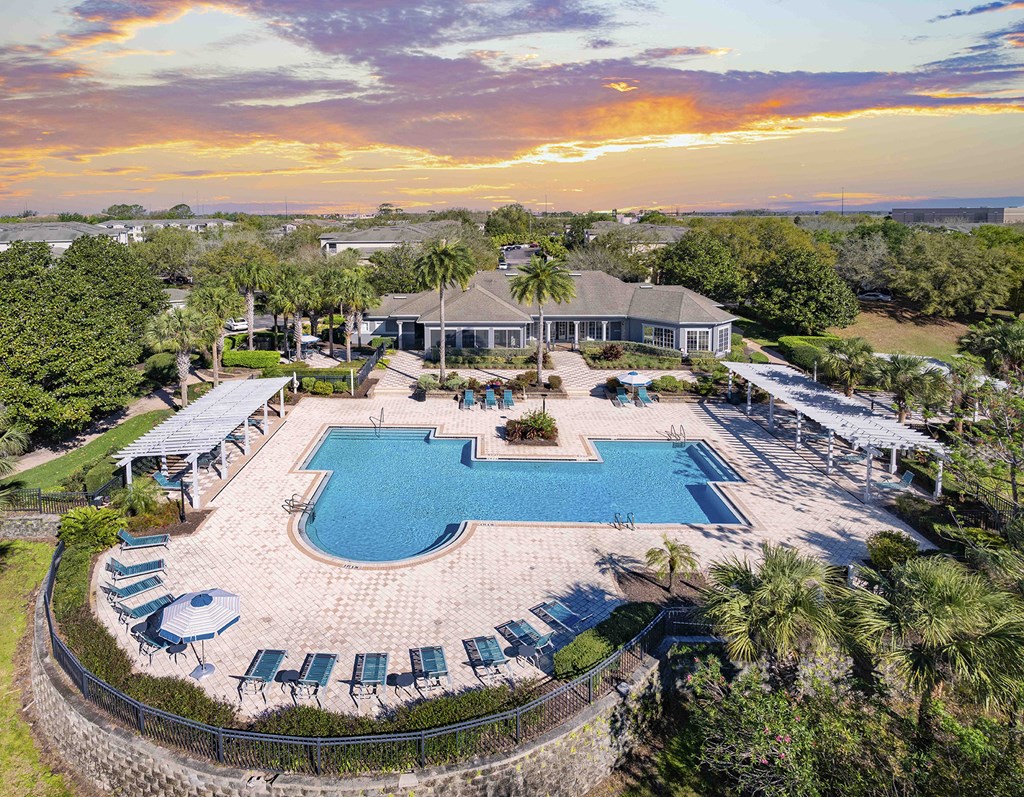 A large house with a pool in the backyard.