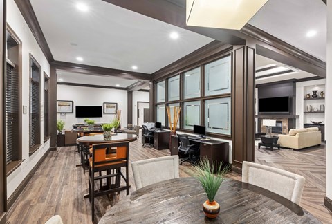 a living room and dining room with a table and chairs