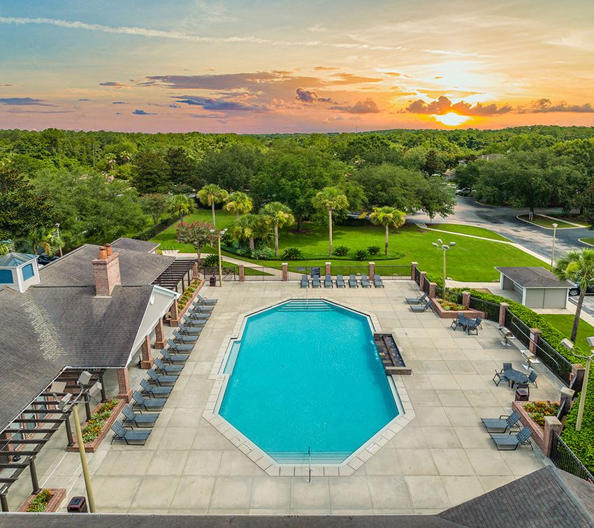 an aerial view of the pool at sunset at the resort at longboat key club