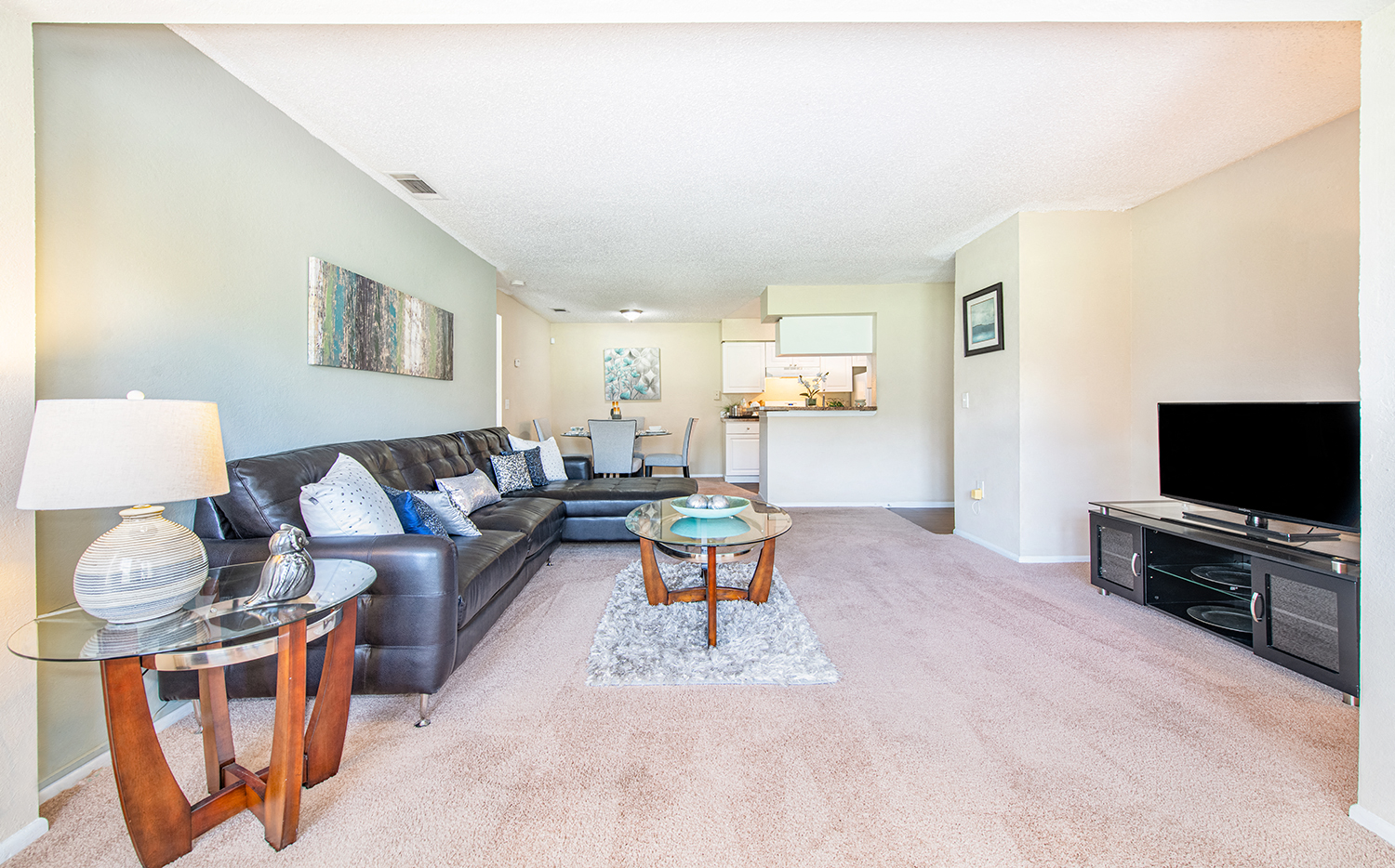 a living room with a couch and a table