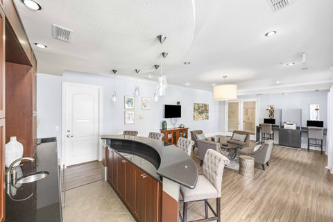 a living room with a kitchen and a dining room
