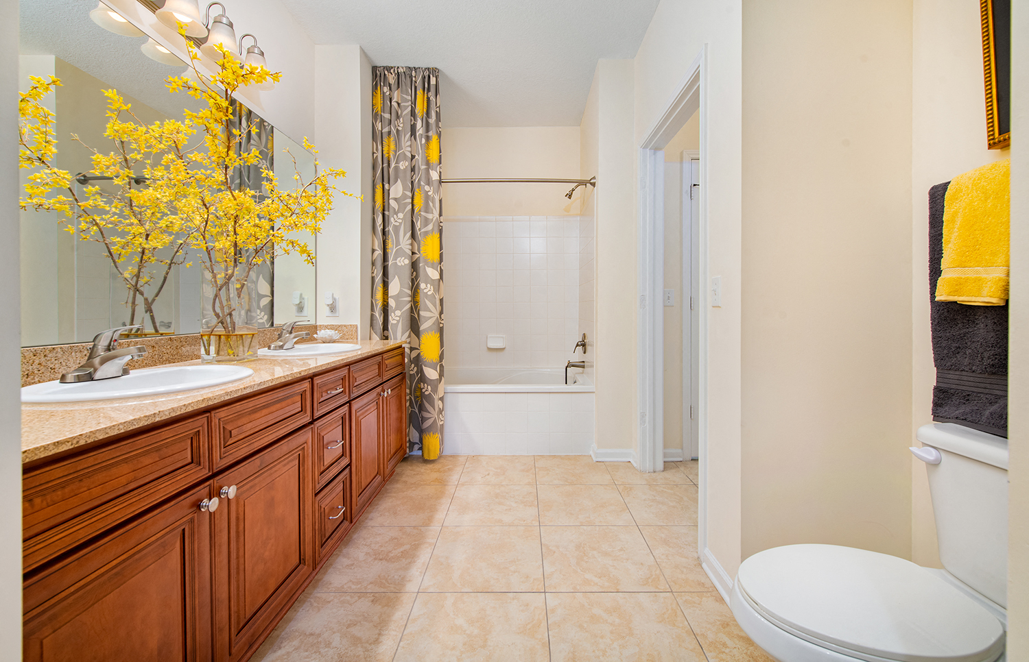 a bathroom with a sink and a toilet and a shower