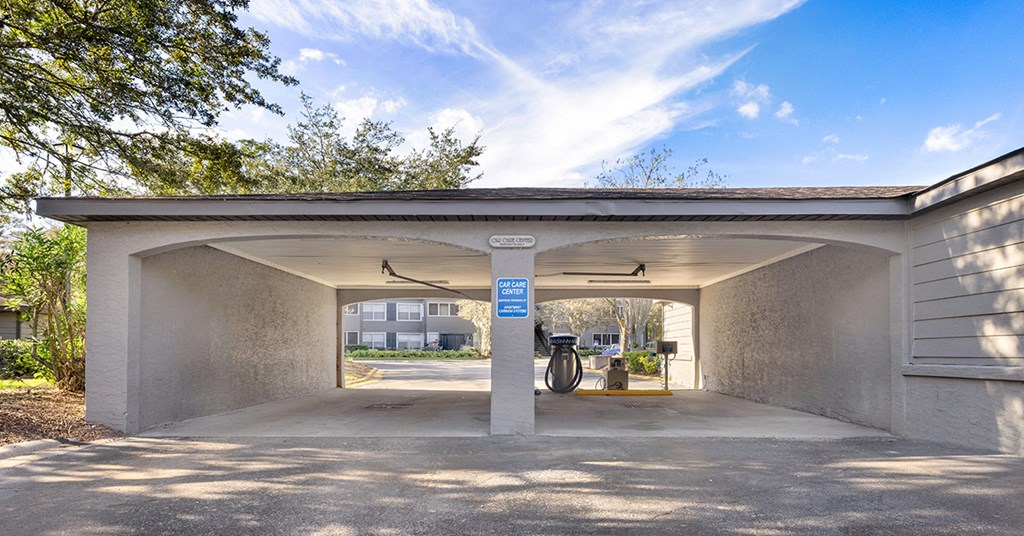 A parking garage with a blue sign on the wall.