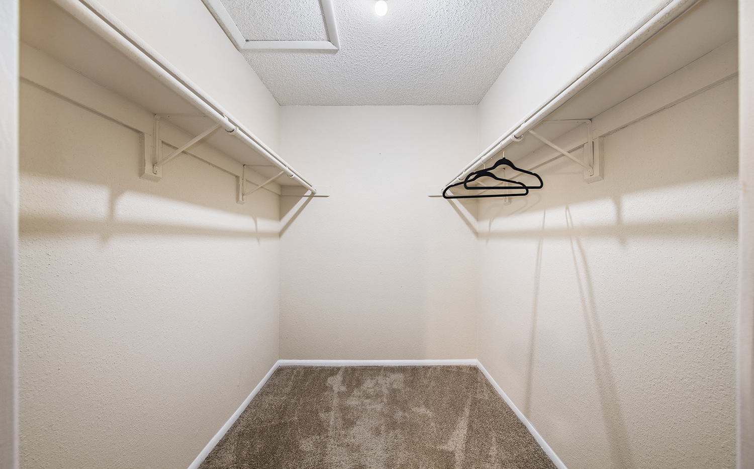 our apartments have a spacious walk in closet with a shoe rack