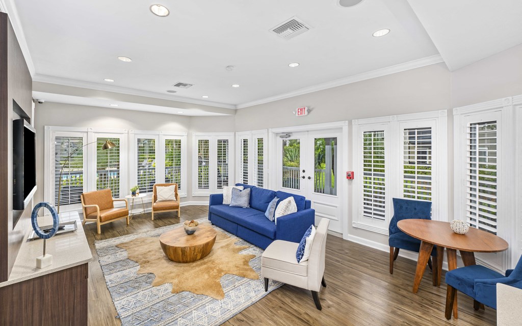 the preserve at ballantyne commons living room with blue couches and chairs