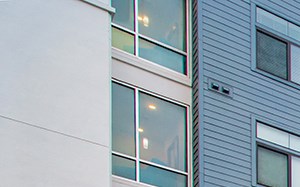 a swimming pool at an apartment building at sunset