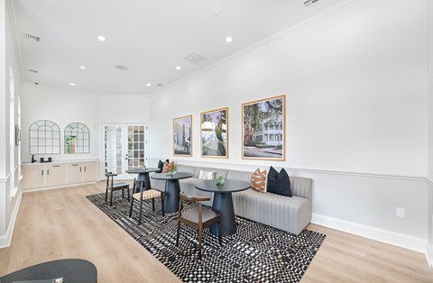 A living room with a grey couch and a coffee table.