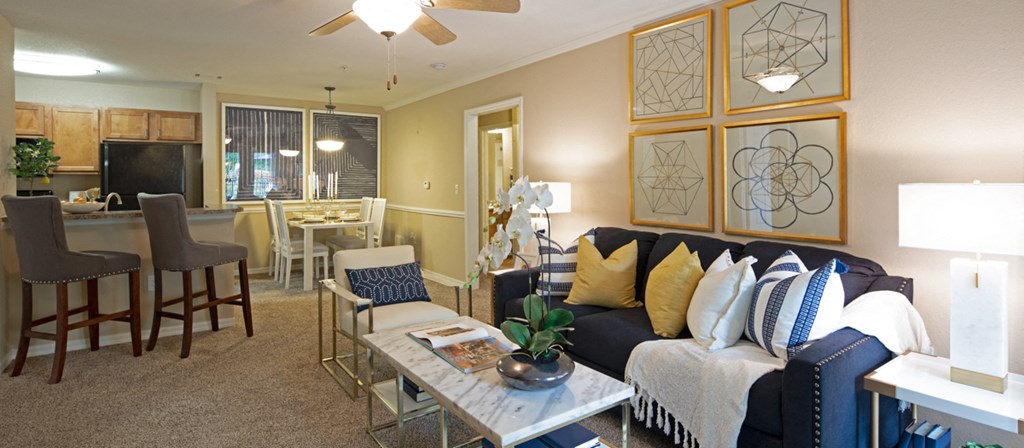 a living room and dining room with a couch and a table