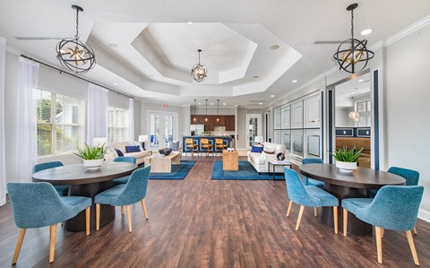 the preserve at ballantyne commons apartments clubhouse with tables and chairs