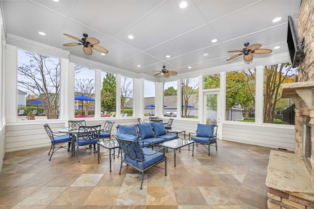 A patio with a table and chairs.