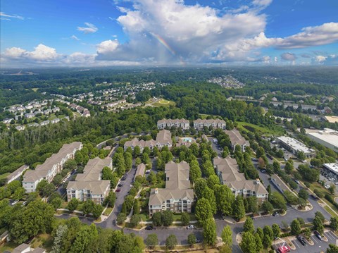 A bird's eye view of a residential area with houses and trees.