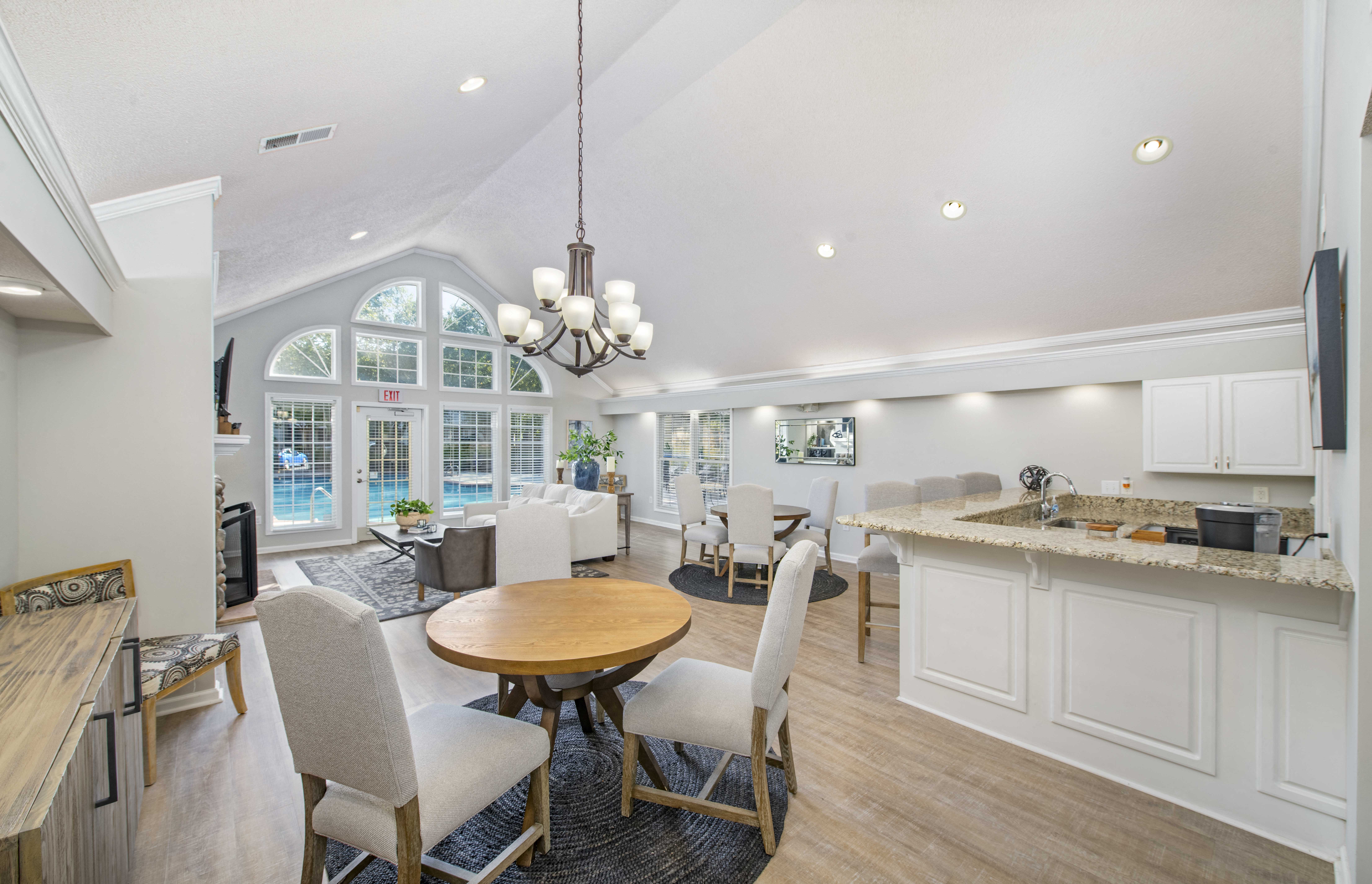 a living room with a kitchen and a dining room