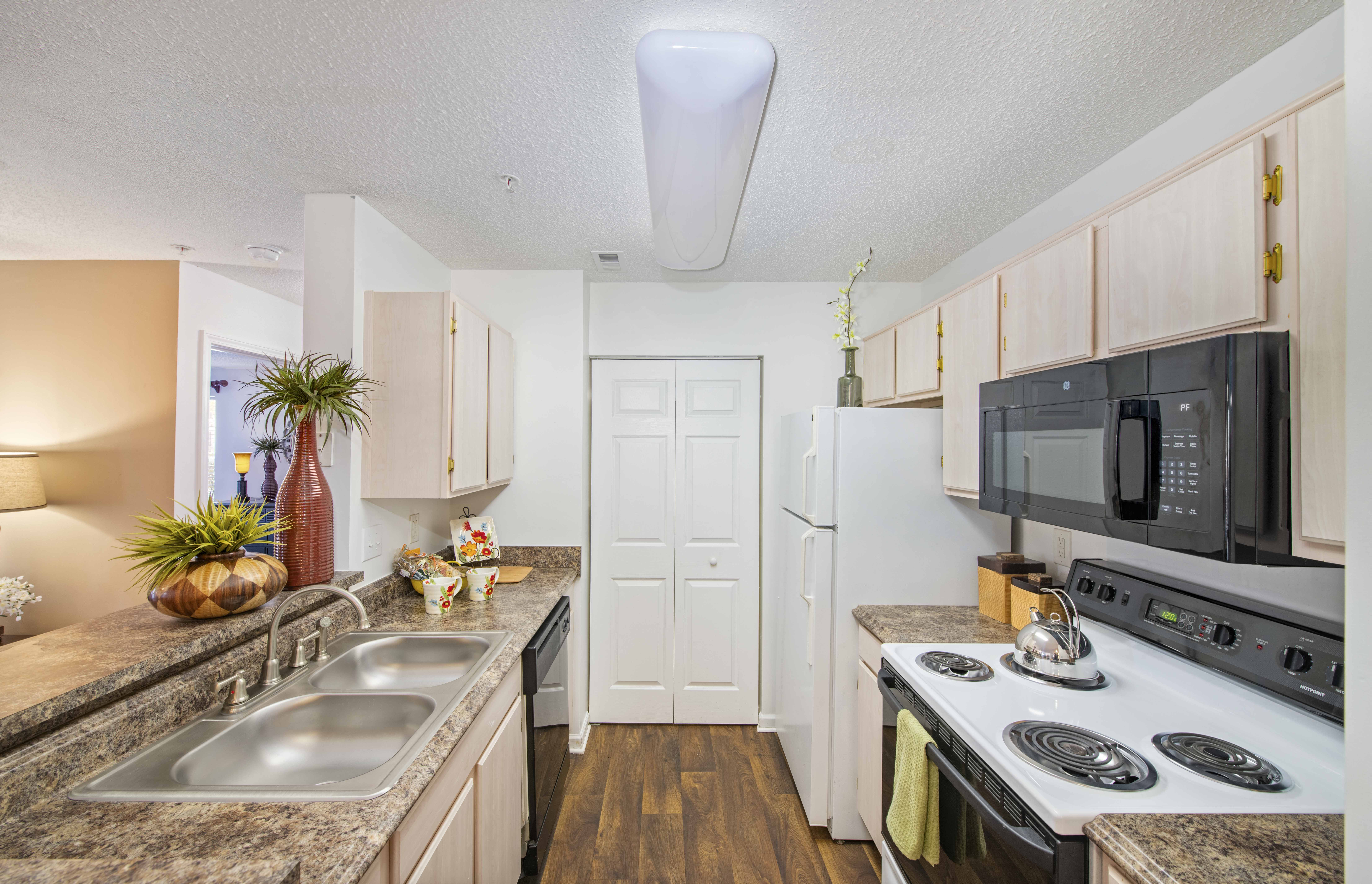 the preserve at ballantyne commons apartment kitchen with stainless steel appliances