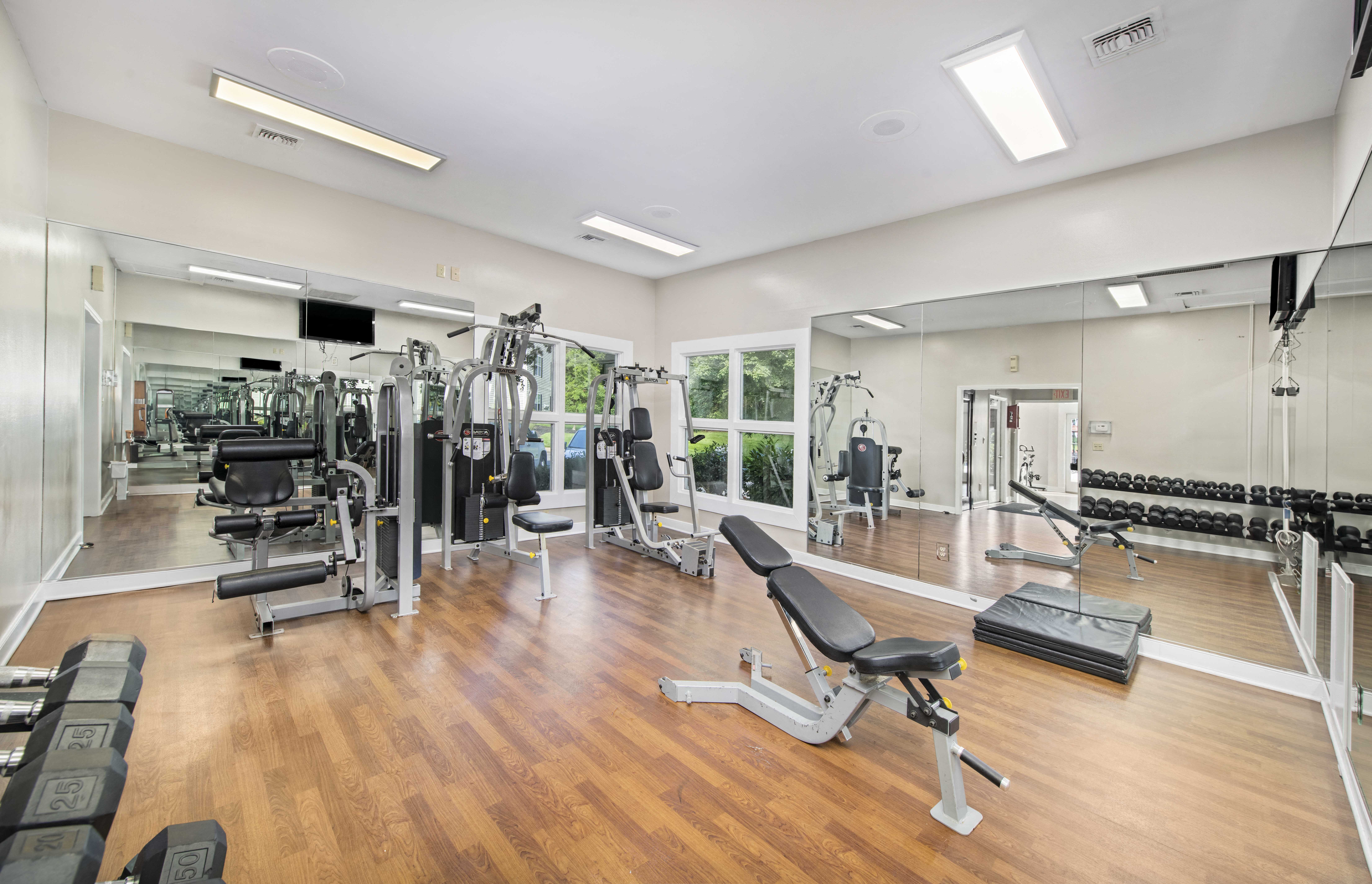 the gym is equipped with state of the art equipment including cardio machines and weights