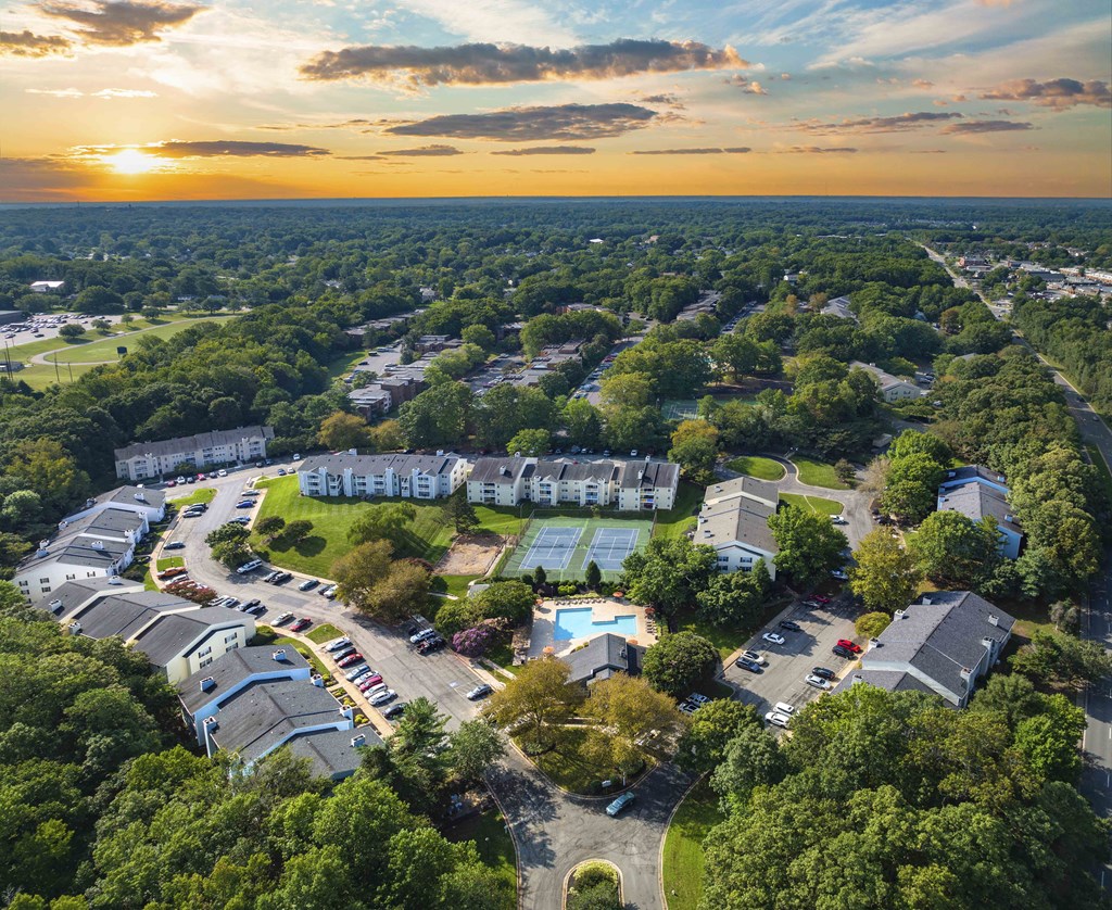 an aerial view of a neighborhood with houses and trees