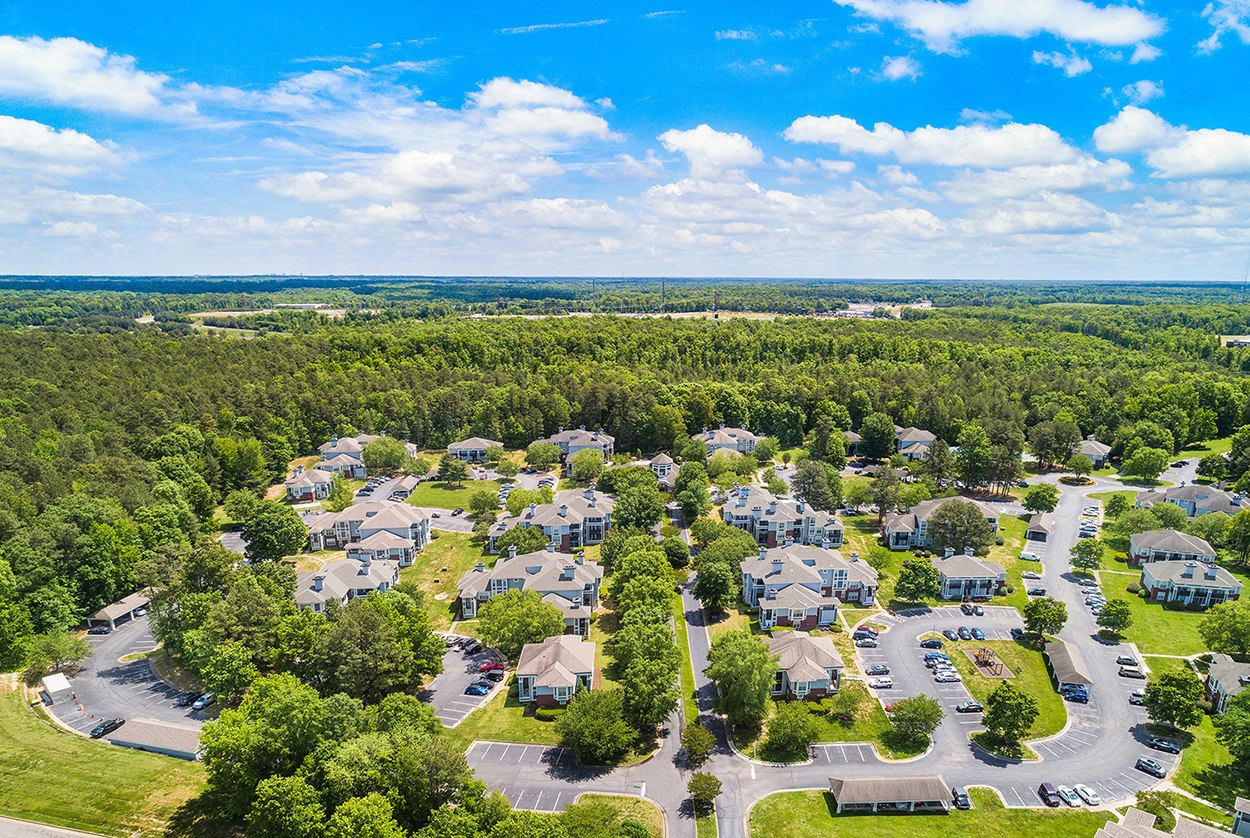 an aerial view of a neighborhood with houses and trees