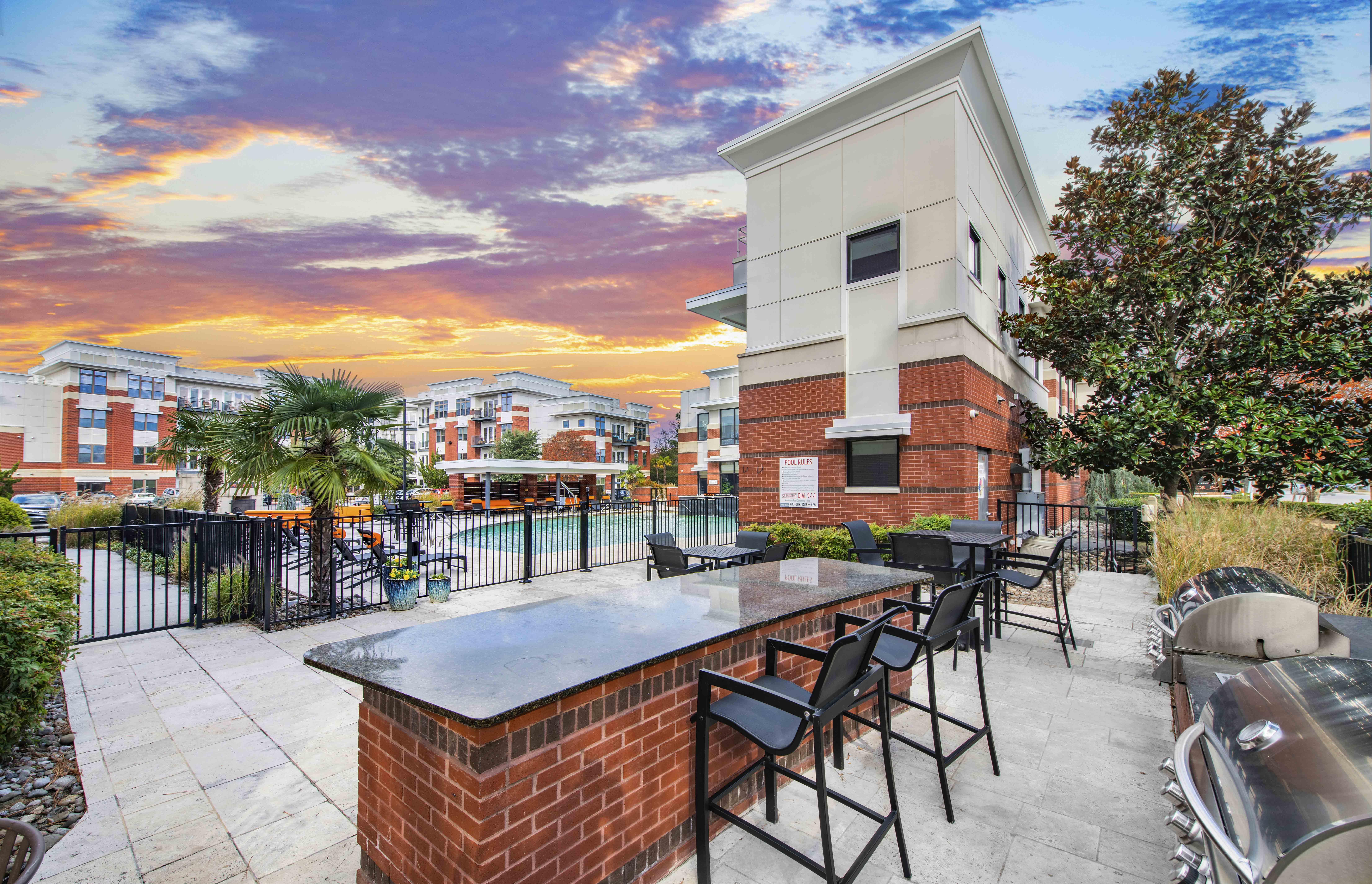 the clubhouse has a large patio with a table and chairs