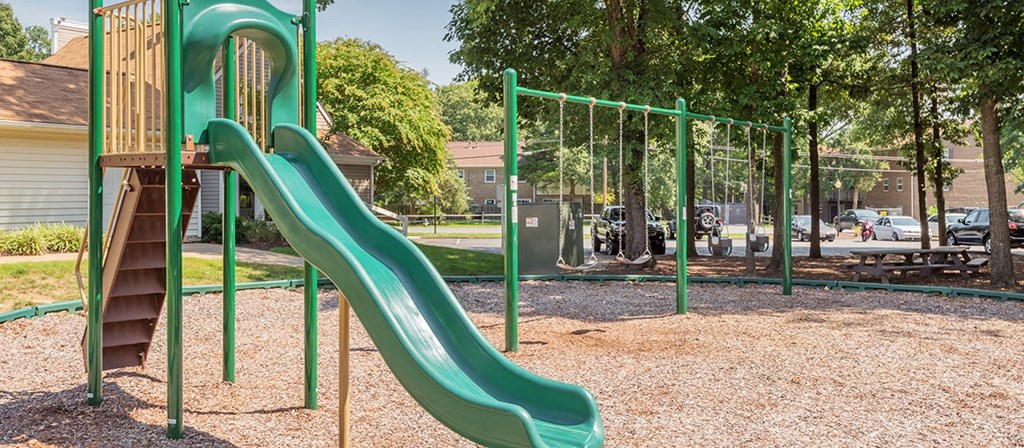 a slide at a playground in a park
