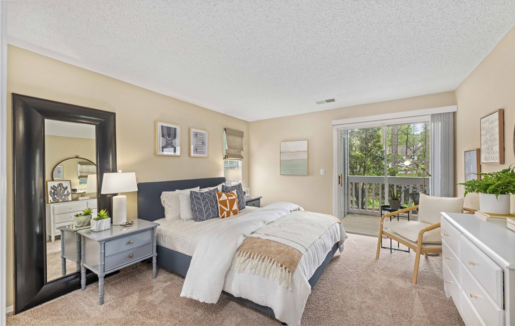 a master bedroom with a large bed and a window