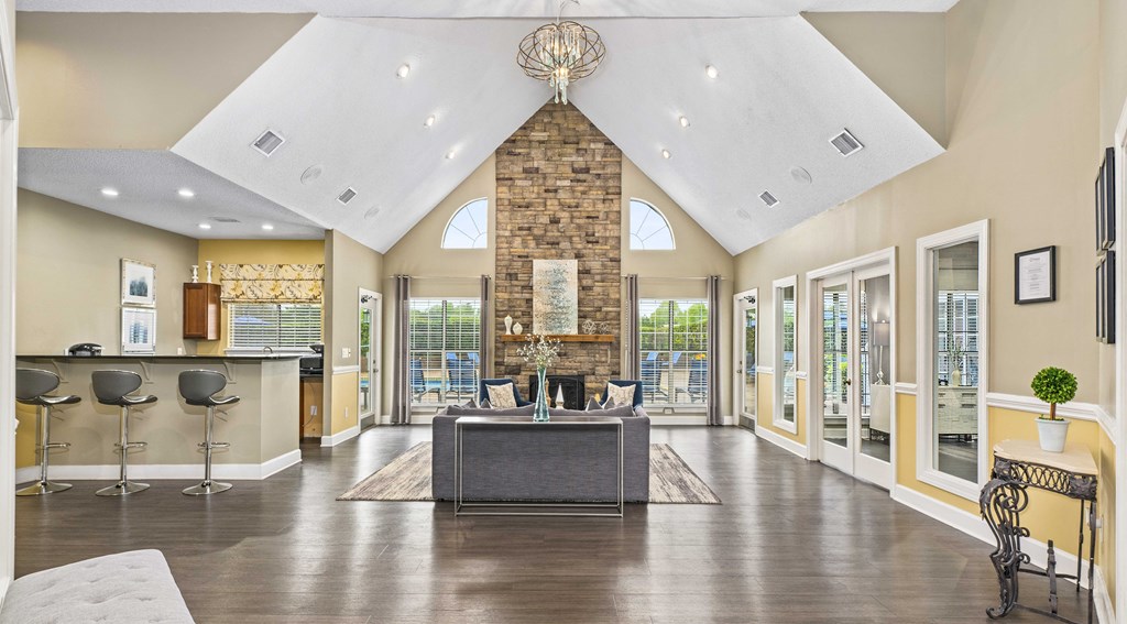 a living room with a fireplace and a table and chairs