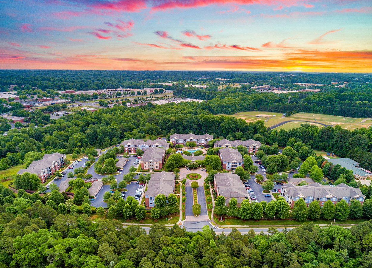 an aerial view of a neighborhood with houses and trees