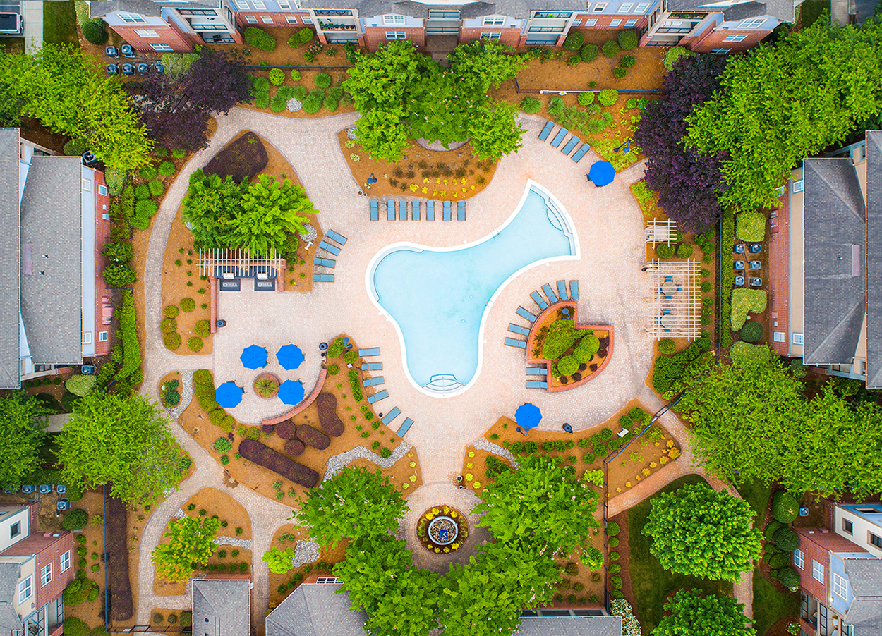 a birds eye view of a swimming pool in a park