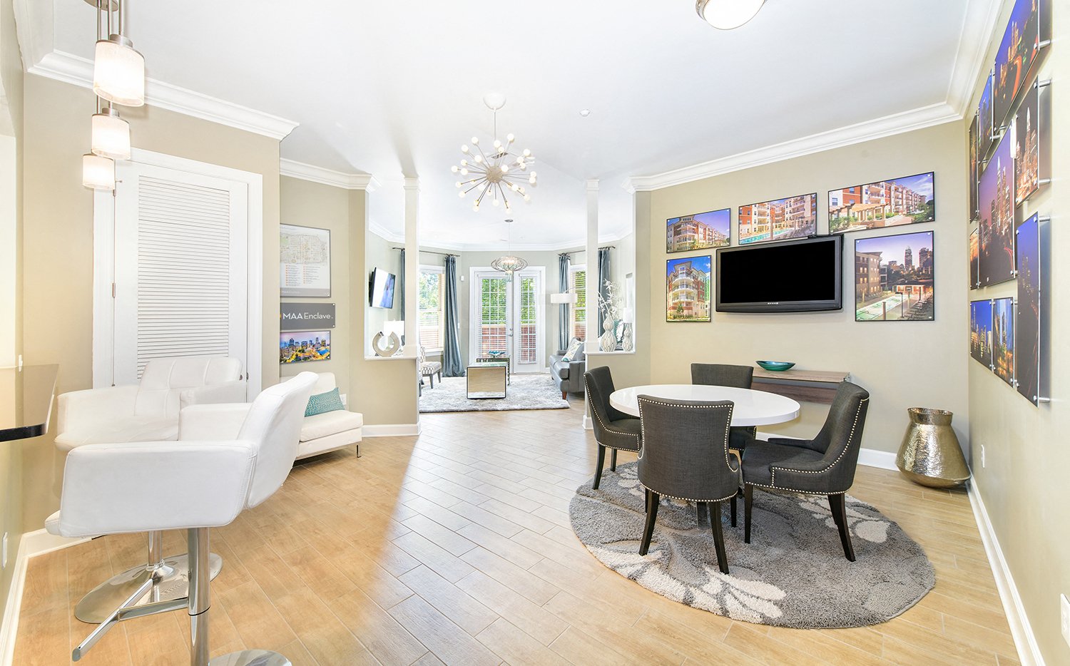 a living room with a table and chairs and a television