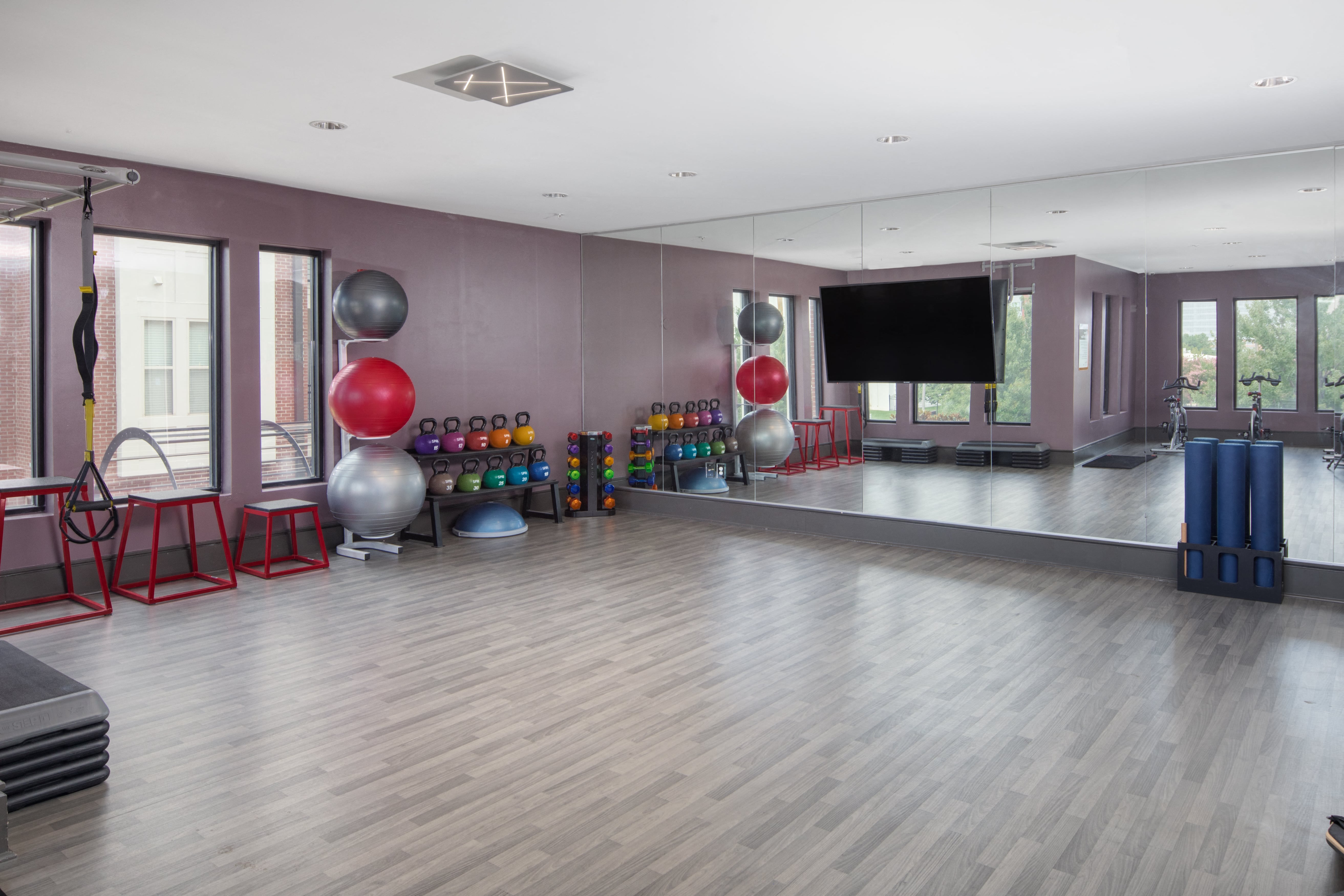 a large room with a dance floor and a large projection screen