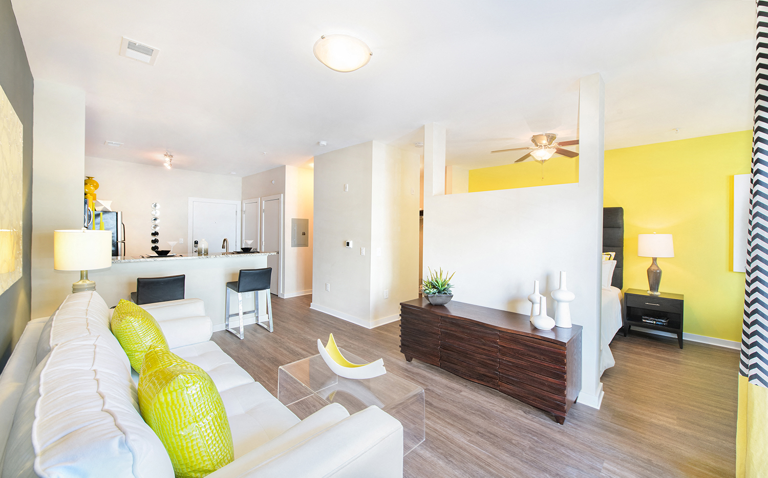 a living room with yellow walls and a white couch