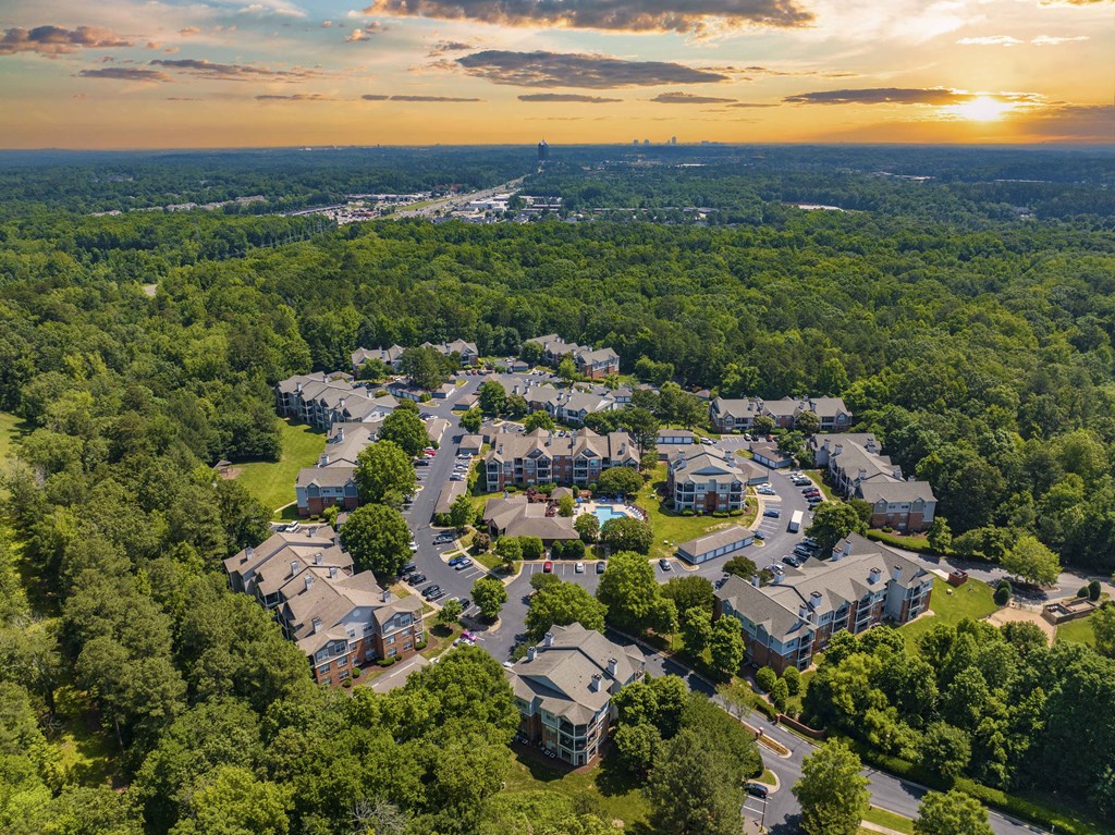 an aerial view of a neighborhood with houses and trees