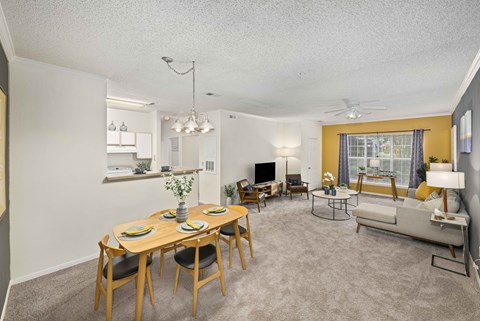 A dining room with a wooden table and chairs.