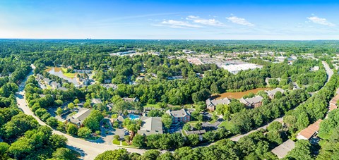 an aerial view of a neighborhood with houses and trees
