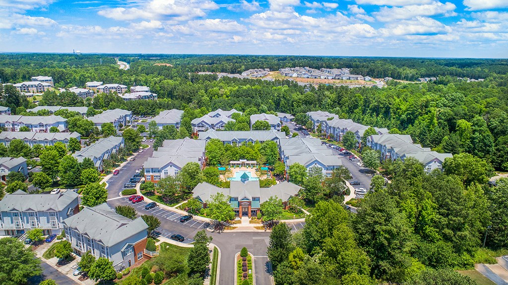 an aerial view of a community with houses and trees