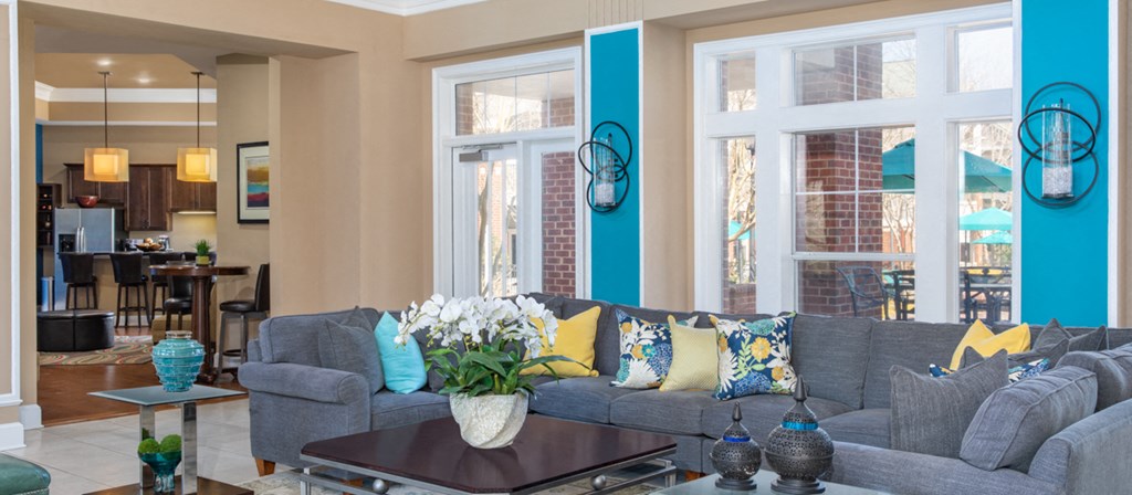 a living room with a gray couch and a coffee table