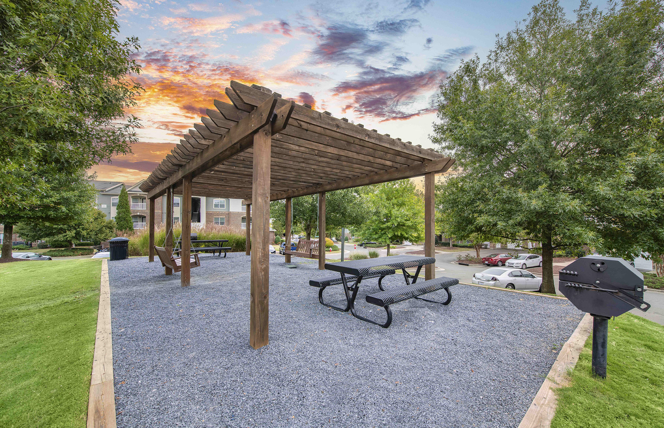 a park with a picnic table and a pavilion