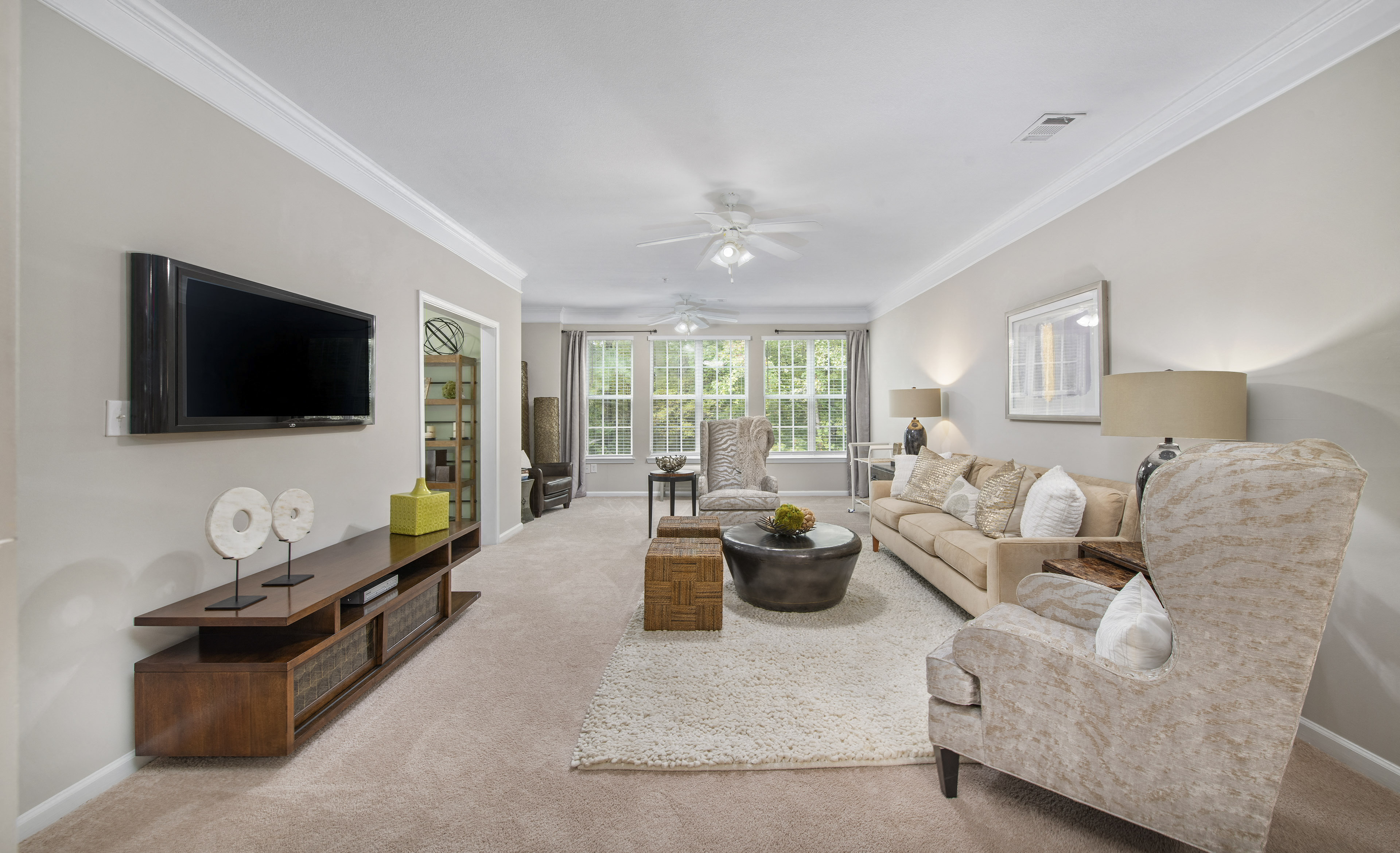 a living room with a couch and a tv