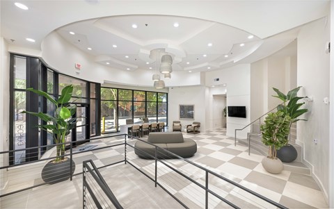 A modern living room with a black and white checkered floor.