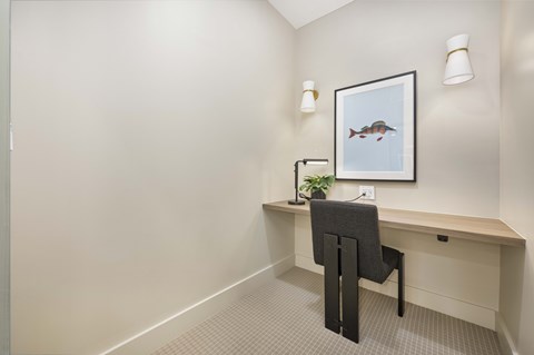 A small office with a desk and chair.