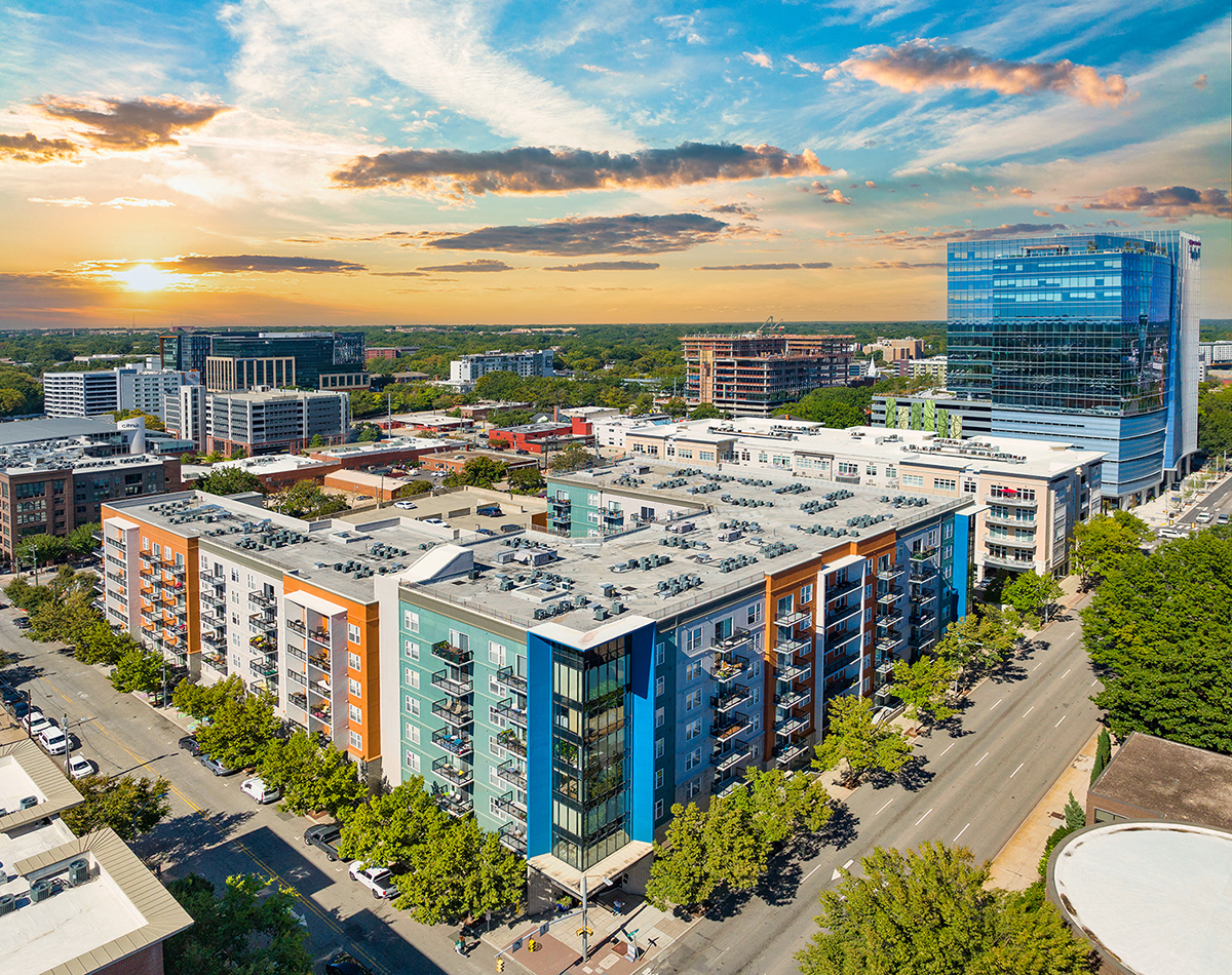 an aerial view of the city at sunset